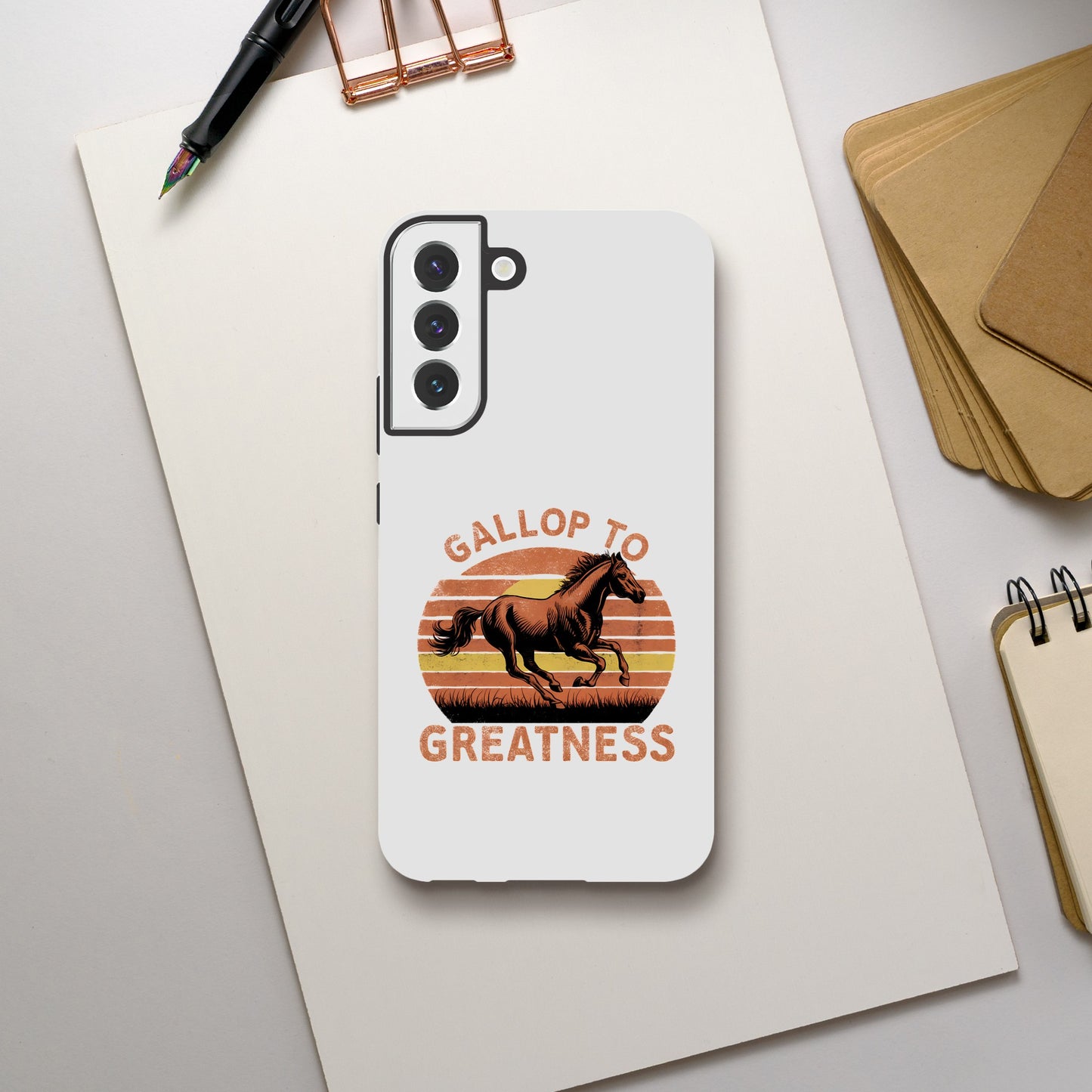 Phone case with an inspiring graphic design of a galloping horse and the inscription 'Gallop to Greatness'
