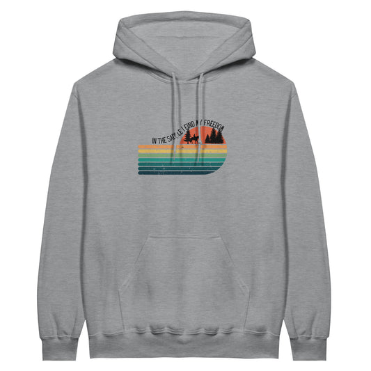 Gray hoodie with a retro-inspired design and the text "In the saddle I find my freedom," ideal for horse lovers.

