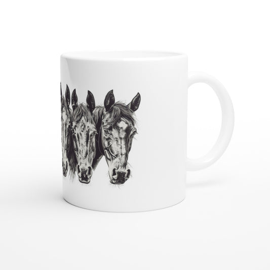 White ceramic mug with three horse head illustrations, ideal for equestrian enthusiasts.

